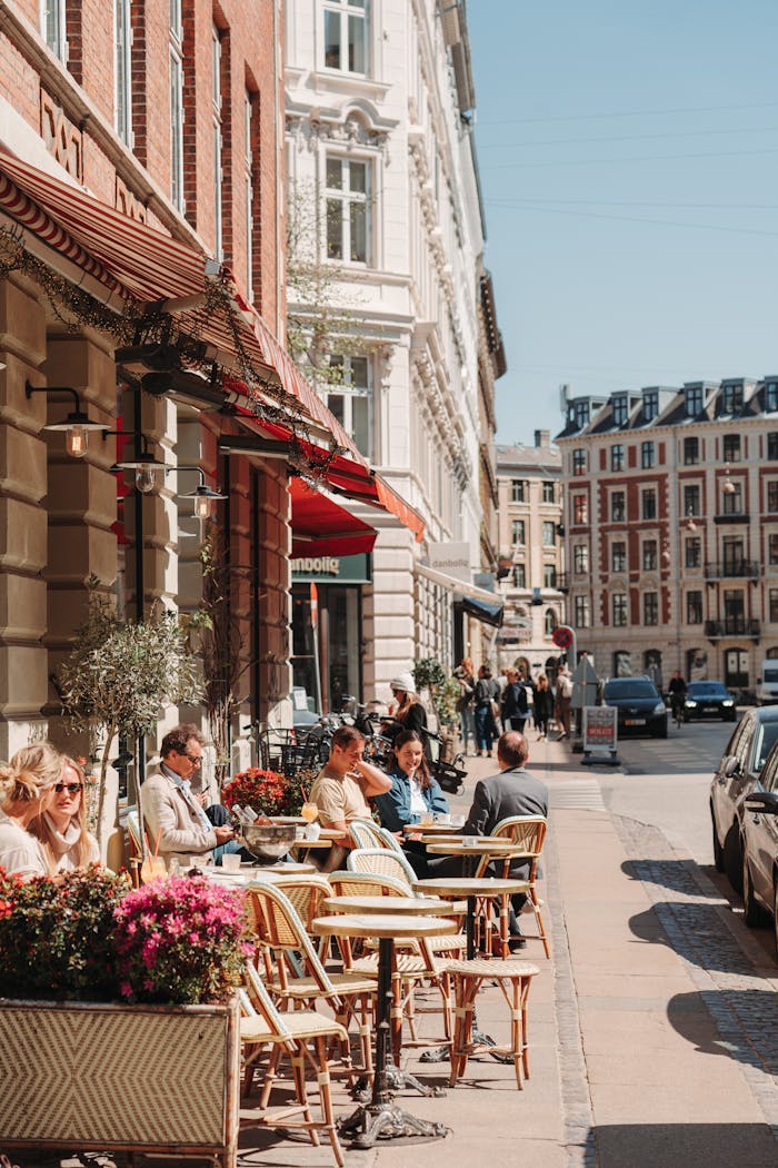 Outdoor café scene on a lively city street, capturing urban leisure and architecture.