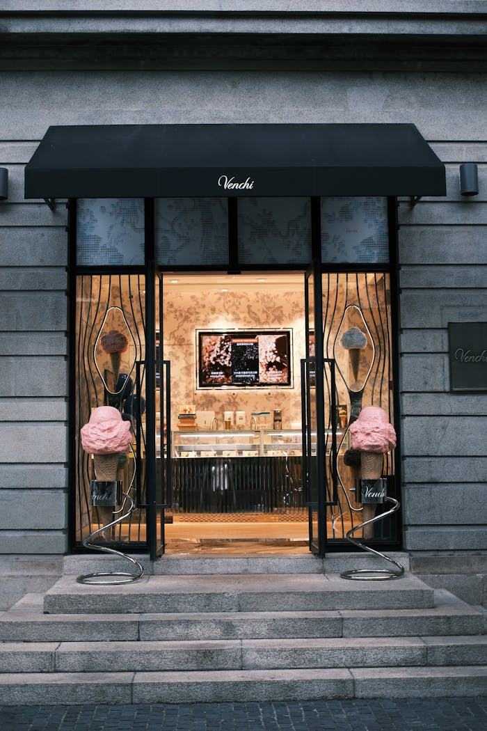 Entrance of a stylish gelato shop showcasing unique designs and inviting display.