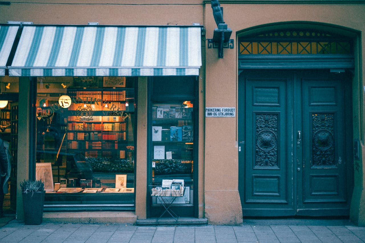 Cozy bookstore entrance with classic design and decorative storefront on a city street.